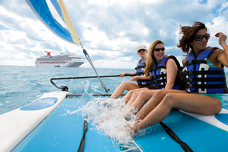 Your catamaran can take you through clear blue waters around Half Moon Cay.